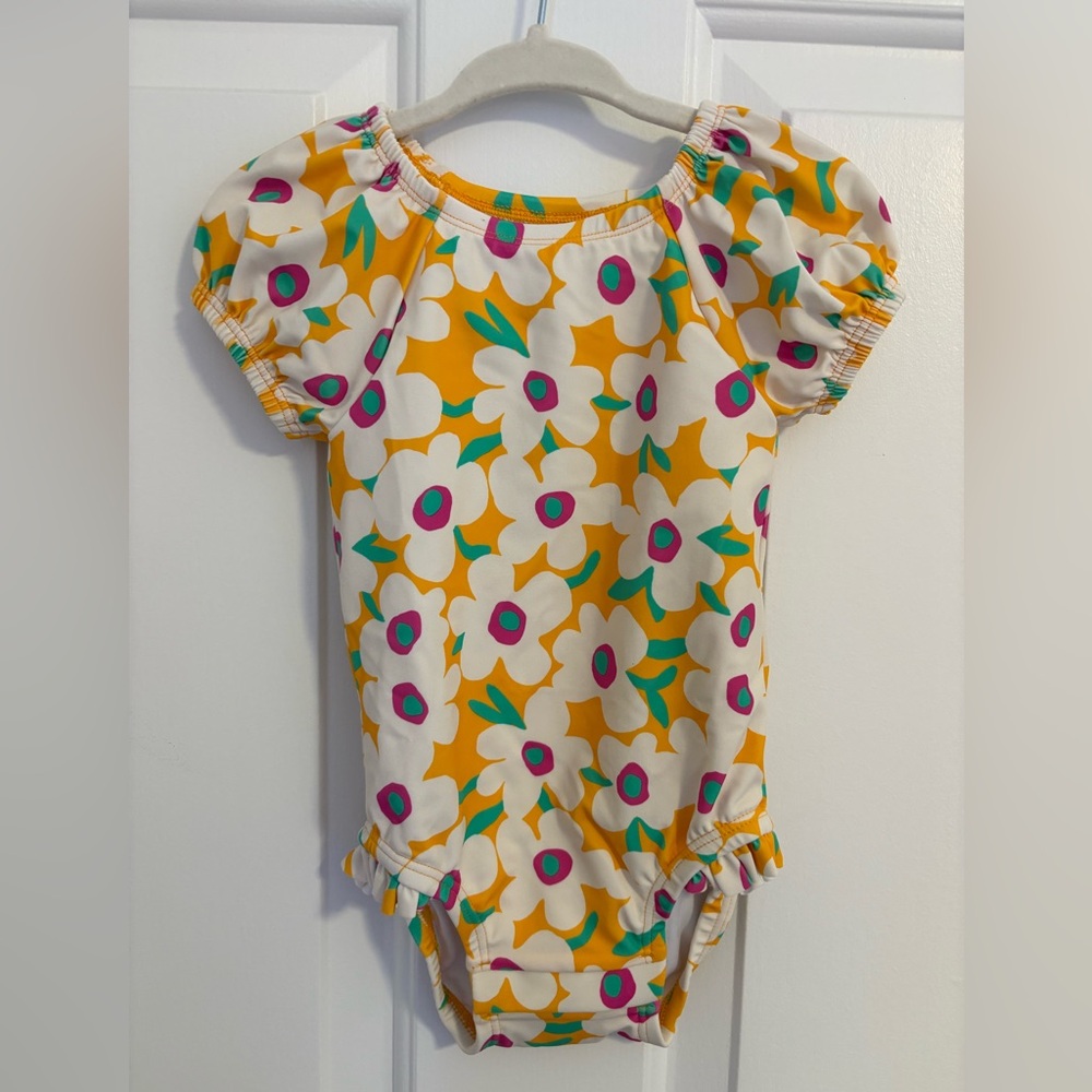 Hanna Andersson one-piece swimsuit in bold poppy print on radiant yellow